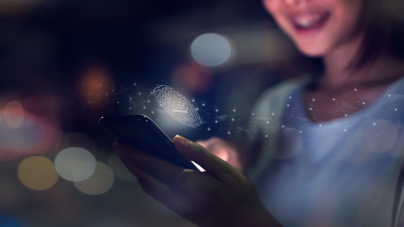 Woman paying by phone securely in the evening